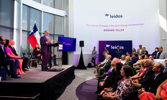 Leidos Sr. Vice President Anil Tailor delivering a keynote to an audience at the new Leidos office in Port San Antonio