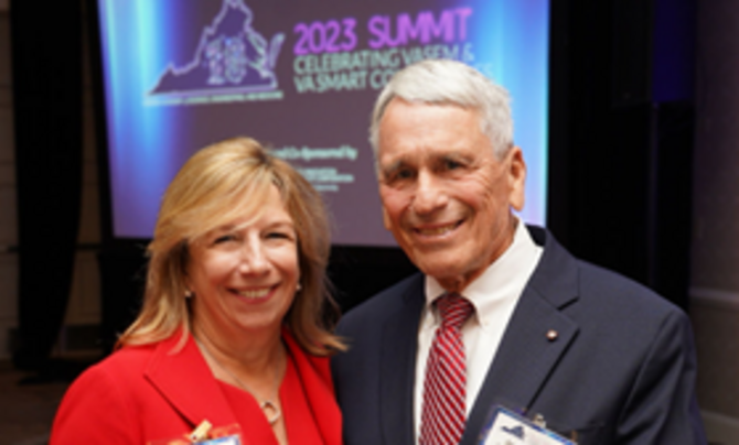 Leidos EVP Vicki Schmanske accepting her election to the  Virginia Academy of Science, Engineering and Medicine from President James Aylor.