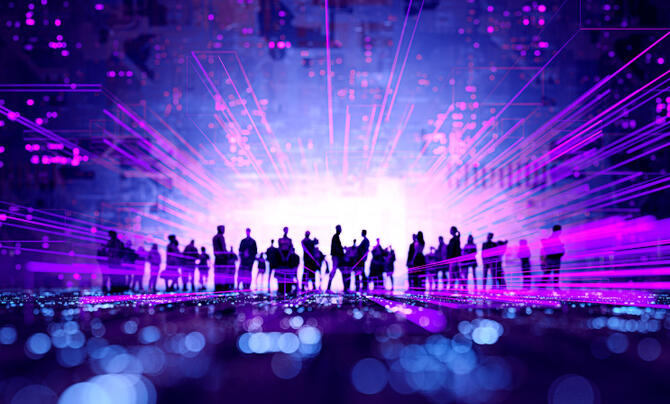 A purple background with silhouettes standing in the foreground