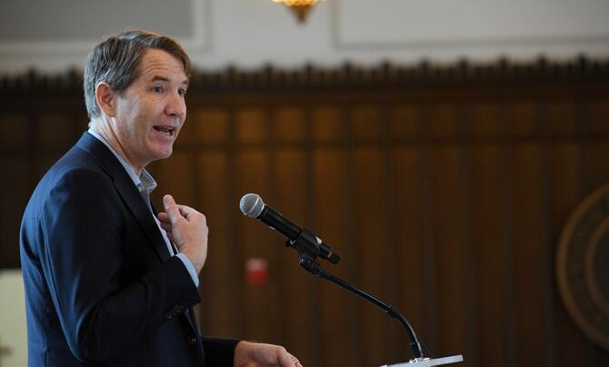 Ron Keesing speaking at podium