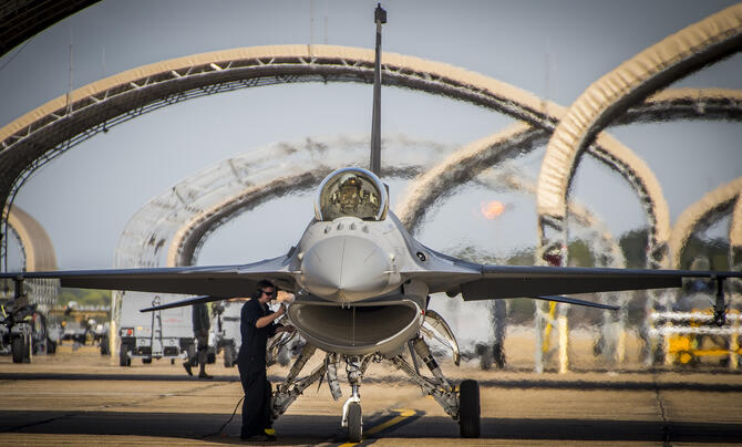 An F-16 goes through a maintenance check prior to entering the refueling area during a hot pit session Dec. 14 at Eglin Air Force Base, Fla.