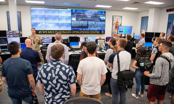 group of people looking at screens