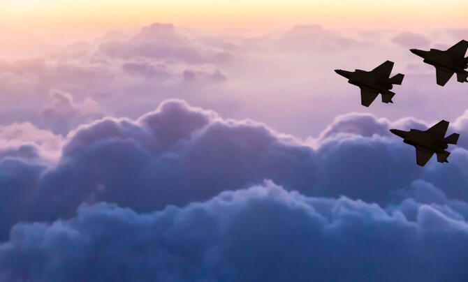 Three planes fly through clouds