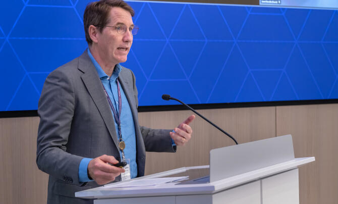 ron keesing speaks at a podium