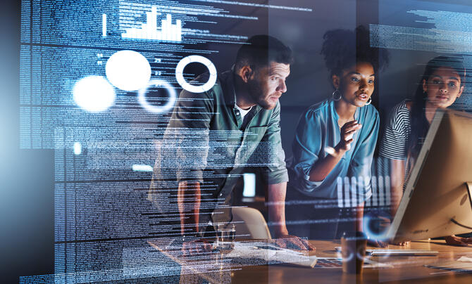 Three team members work together on a project.
