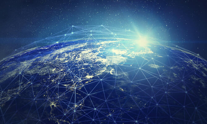 Illustration of an electronic interconnected nodes laid out over an Earth-like planet