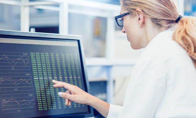 Scientist reviewing data on computer