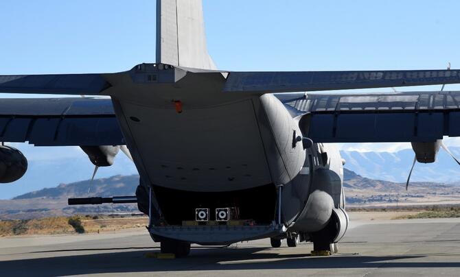 A ramp is attached to a C-130 for SCM test launch.