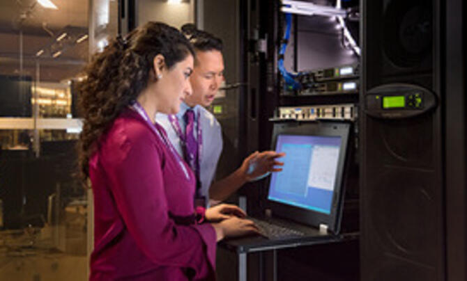 IT professionals at work in a Leidos facility
