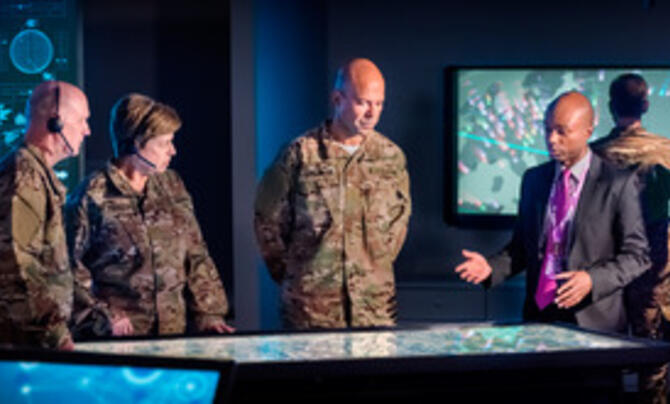 employees looking at screen