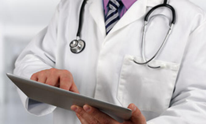 Medical professional using a tablet