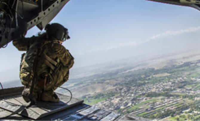 Service personnel looking out of aircraft