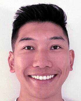 A man smiling at the camera