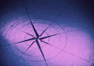 A stylized compass rose is drawn on a textured surface, illuminated by purple and blue lighting. The design features radiating lines and circular markings centered on a star-like shape.