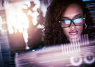 Woman working in front of a computer screen