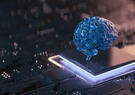 A translucent blue brain model sits atop a glowing computer chip on a circuit board, symbolizing artificial intelligence, machine learning and advanced computing technologies.