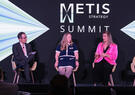 A panel of speakers participates in a discussion at the Metis Strategy Summit, sharing insights on leadership and technology strategy.