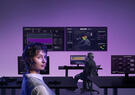 a women in front of computer screens with the imperium product