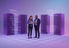 two people stand in front of servers