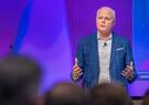 Leidos CEO Tom Bell addressing audience