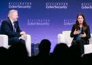 Two speakers discuss cybersecurity on stage during a panel at the 2026 Billington CyberSecurity Summit.