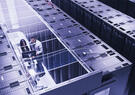 Two professionals in a data center