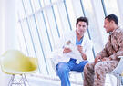 Military Health with doctor and solider discussing care