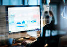 man at computer working