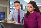 Workers looking at laptop screens