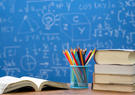 STEM scholarship with books and pencils with chalk board background