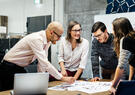 Team collaborating over table