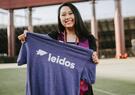 T. Van holding Leidos shirt