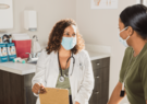 doctor with mask on treating patient