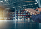warehouse and employee using tablet