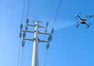 A drone inspecting electricity power lines