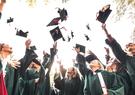 New graduates tossing their caps in celebration