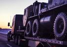 18-wheeler on road at sunrise