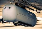 A Leidos military pod attached to a Douglas DC-3 test aircraft