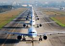 Planes lined up on runway 