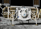 Astronaut next to a lunar lander on the moon