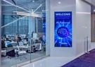 A meeting space at Leidos Global Headquarters with AI Palooza signage