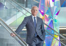 Thomas Bell standing in a stairway at Leidos GHQ