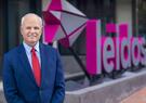 Tom Bell in front of Leidos GHQ in Reston, Va.