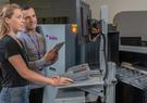 Leidos employees working at a airport security checkpoint