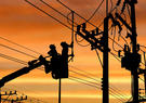 Line workers in silhouette 