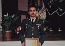 Jeff Coppa standing with an award