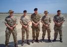 5 men in military uniforms
