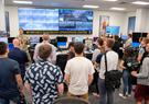 group of people looking at screens