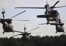 U.S. Army UH-60 Black Hawks take off in a multi-ship formation for training.