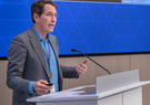 ron keesing speaks at a podium